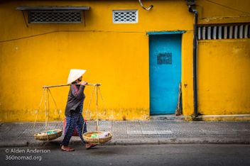 Hoi-An-Yellow-wall-blue-dorr-Woman
